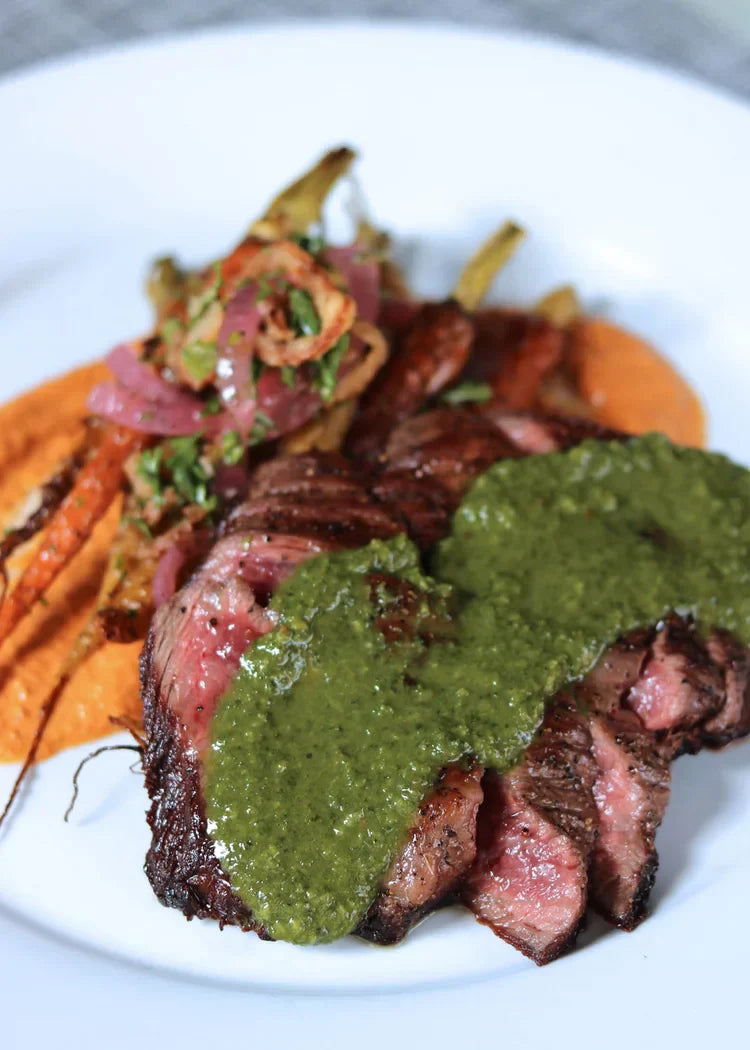 Skirt Steak With Roasted Carrots, Romesco, Carrot Top Salsa Verde